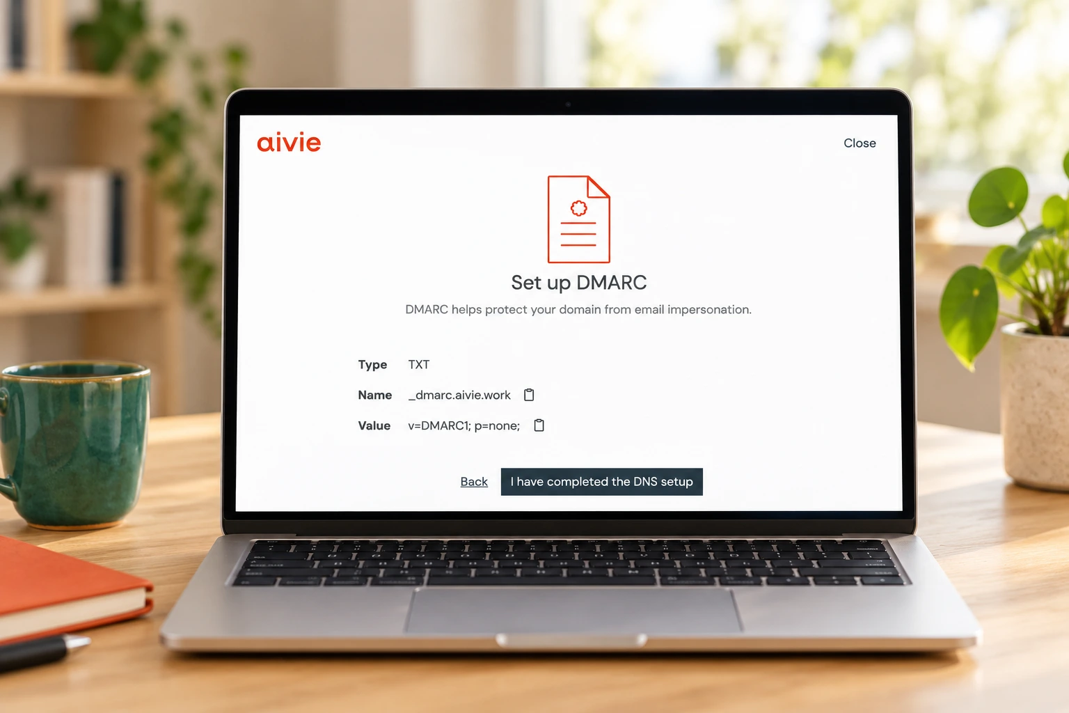 Laptop showing the Aivie Setup Wizard at the step for setting up DMARC.